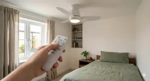 Close-up of a contemporary white bedroom ceiling fan featuring a bright, integrated LED light fitting for a guest room.