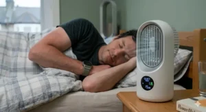 A diagram illustrating oscillating air movement from a pedestal fan to prevent stagnant hot air in a standard-sized UK master bedroom.