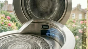 Close-up of the automatic humidity sensor graphic on a modern kitchen fan unit.