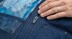 Close-up texture shot of the breathable, lightweight fabric of the cooling vest.