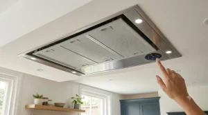 Contemporary ceiling extractor fan design with integrated LED downlights providing task lighting over a hob.