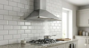 Traditional chimney-style cooker hood installed on a tiled kitchen wall.