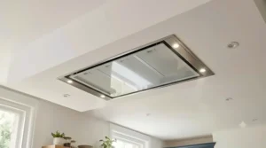 Low-profile flush-mount ceiling extractor fan installed seamlessly into a white plasterboard kitchen ceiling.