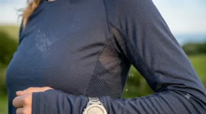 A detailed closeup of the breathable mesh panels and moisture-wicking fabric structure of the long sleeve cooling shirt.