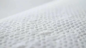 Macro shot showing the intricate texture of the breathable, moisture-wicking fabric surface of the cooling pad.