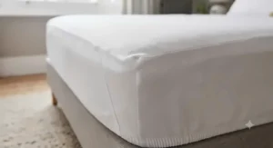 Macro shot of advanced cooling yarn and weave used in a premium UK mattress protector for hot sleepers.