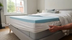 Deep-pocket elasticated straps securing a memory foam mattress topper firmly onto a standard UK king-size mattress.