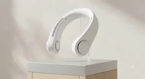 A studio shot of a lightweight, white wearable neck fan showing the sleek, cordless design.