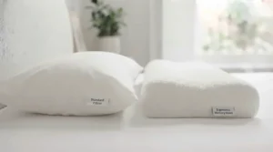Hand pressing down on high-density memory foam to demonstrate its slow-recovery cushioning and durable pressure relief.
