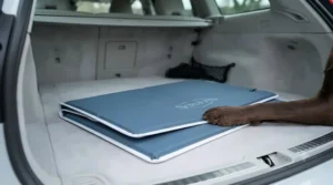 Travel-friendly foldable dog cooling pad laid out neatly inside a car boot ready for a weekend trip.