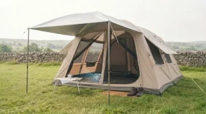 A brightly pitched tent with open mesh doors and an extra sunshade tarp set up for maximum airflow