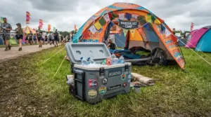 A battery powered cooler for camping keeping drinks cold outside a festival tent in muddy British weather.